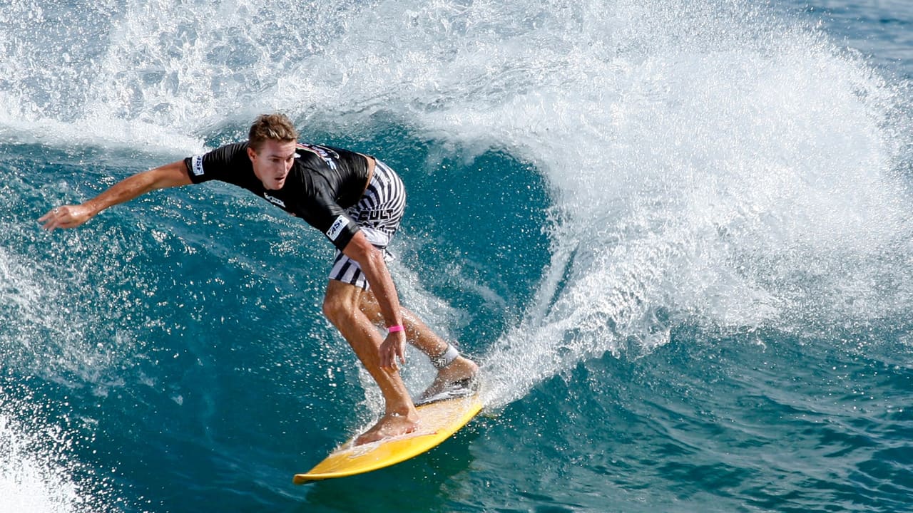 A surfer turning off the top of a wave at Arugam Bay.