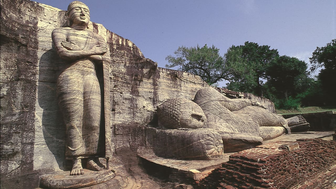 The standing and reclining Buddha figures at Gal Vihara, Polonnaruwa, carved from a single granite face.